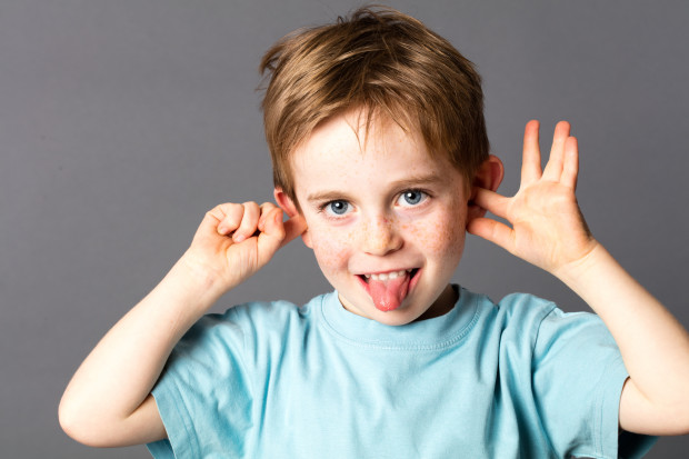 cute little child not listening, sticking out his tongue debt collection agencies