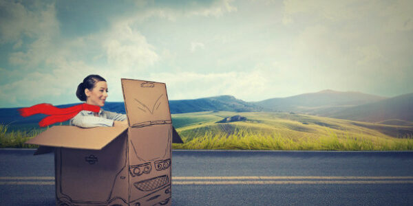 Happy car driver on a countryside road . auto debt collections