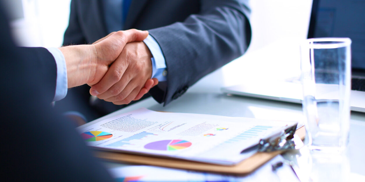 Business people shaking hands, finishing up a meeting