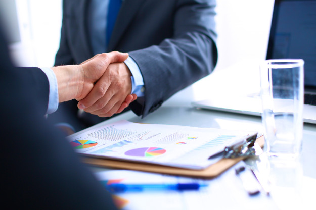 Business people shaking hands, finishing up a meeting