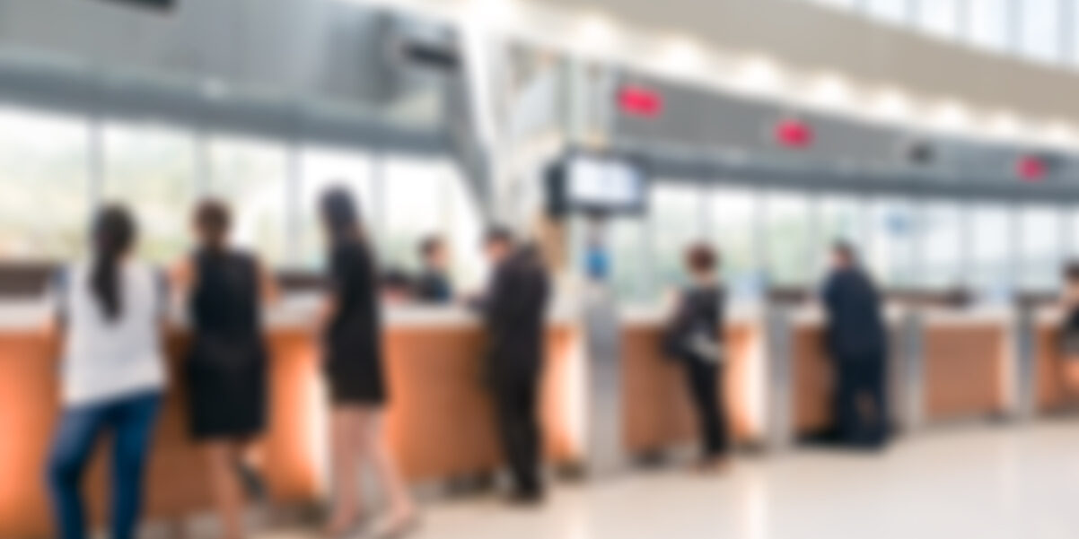 Blurred customer transaction in bank counter credit union collections