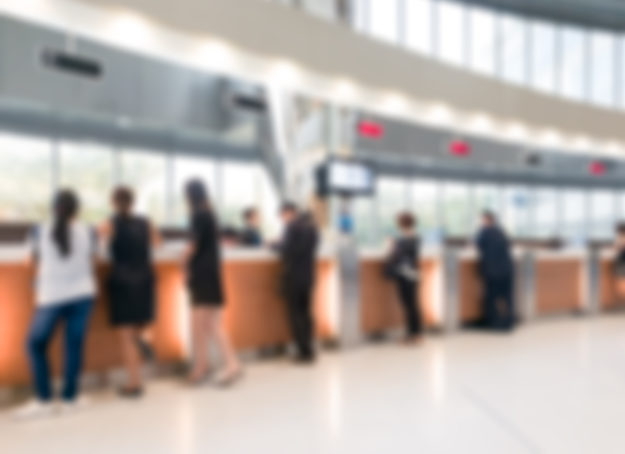 Blurred customer transaction in bank counter credit union collections