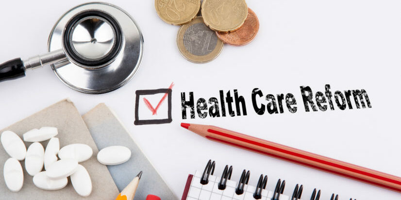 health care reform. Questionnaire with red cross on the white paper value based healthcare