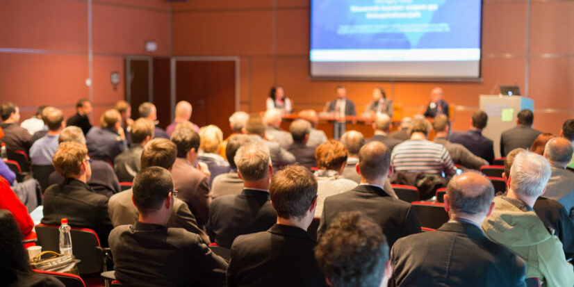Audience at the conference hall. optio solutions