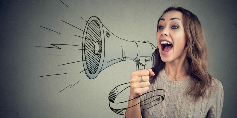 Cheerful woman sharing with news using loudspeaker commercial collectors