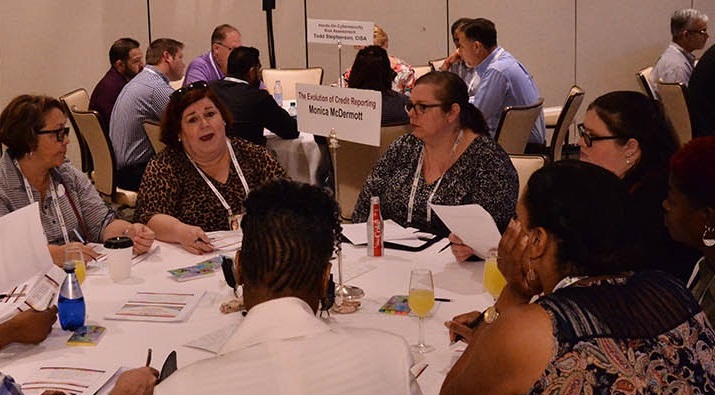 CRS attendees sit at educational round table.