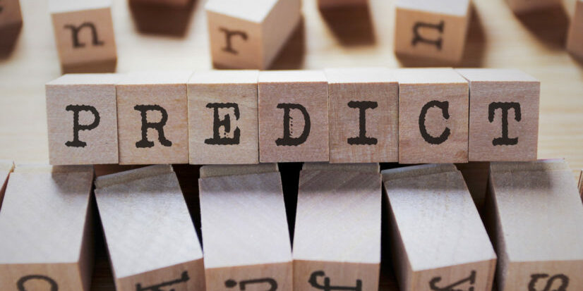 Wooden blocks spelling out predict