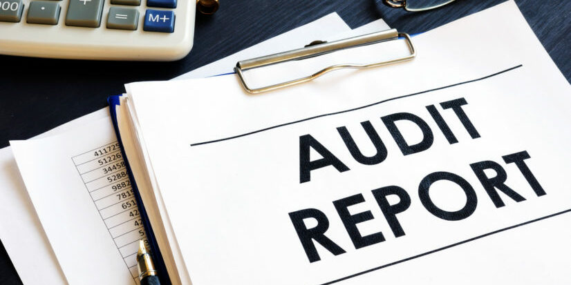 Audit report with business documents in an office.
