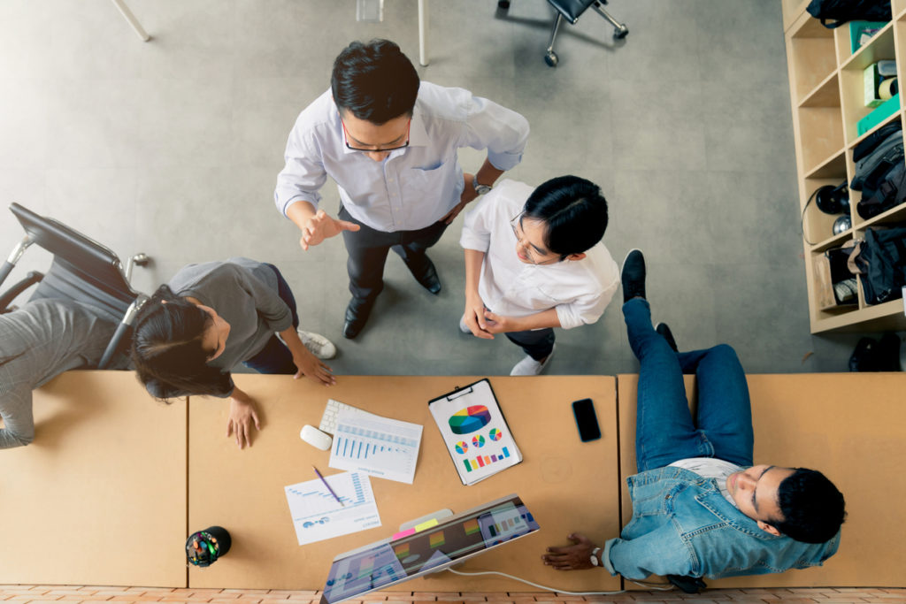 topview of Group of colleagues having an informal meeting ,Business people discussing ideas in office